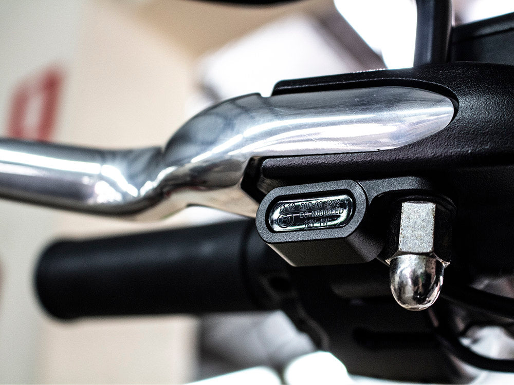 Under Perch Turn Signals - Black. Fits Softail 1984-2014, Dyna 1991-2017 & Sportster 1982-2003.
