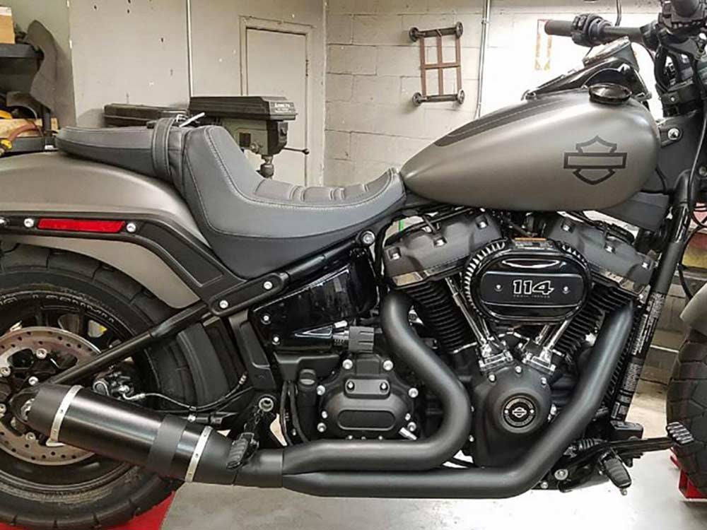 Bob Cat 2-into-1 Exhaust - Black with Carbon Fibre Sleeve Muffler. Fits Softail 2018-2024 Non-240 Tyre Models