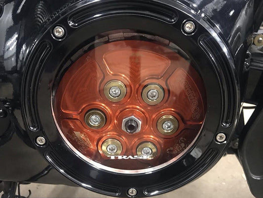 Assault Clear Derby Cover - Gloss Black. Fits Softail 1999-2018, Dyna 1999-2017 & Touring 1999-2015.